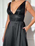Sparkly Glitter Deep Neckline and Open Back Dress with High-Low Pleated Skirt and Pockets In Black